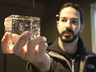 Joe Ambrose of Favourite Ice holds one of his crystal-clear artisanal cubes.