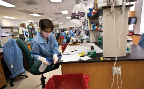 A criminalist tests a sexual assault kit in the Houston Forensic Science Center lab.