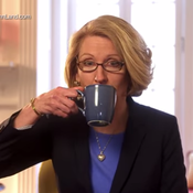 In this campaign ad, GOP candidate Terri Lynn Land sips coffee after asking the viewer to &quot;think about&quot; accusations that she's waging a war on women.