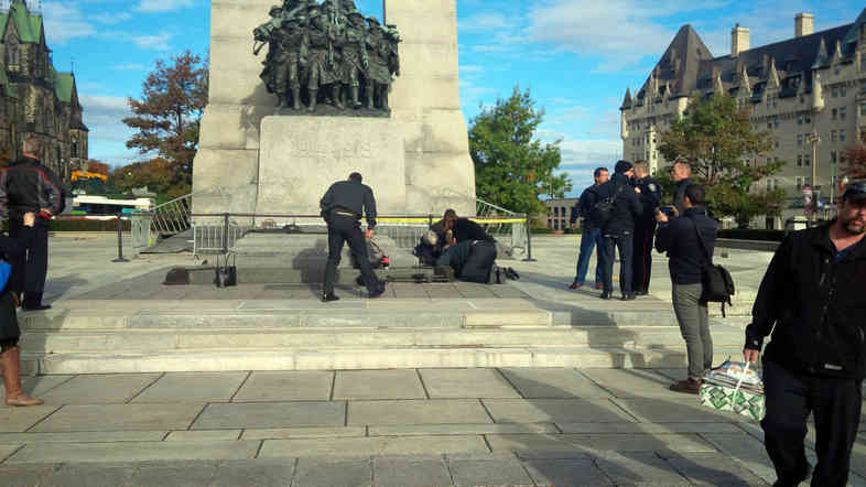 A Canadian soldier who was shot outside the war memorial on Parliament Hill in tended to in Ottawa on Wednesday.