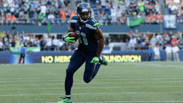 Wide receiver Percy Harvin #11 of the Seattle Seahawks carries the ball against the Denver Broncos at CenturyLink Field on September 21, 2014 in Seattle, Washington.  (Photo by Jeff Gross/Getty Images)