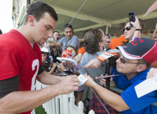 BEREA, OH - JULY 26: Quarterback Johnny Manziel #2 of the Cleveland Browns signs autographs after practice during training camp at the Cleveland Browns training facility on July 26, 2014 in Berea, Ohio.
