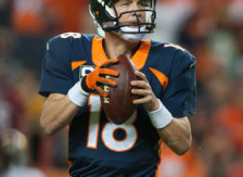 DENVER, CO - OCTOBER 19: Quarterback Peyton Manning #18 of the Denver Broncos drops back to throw on what would be his 509th career touchdown pass in the second quarter of a game against the San Francisco 49ers at Sports Authority Field at Mile High on October 19, 2014 in Denver, Colorado.