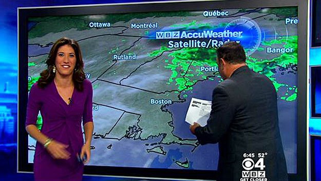 David Robichaud interrupts Danielle Niles's forecast to remove a spider from the screen. (WBZ-TV)
