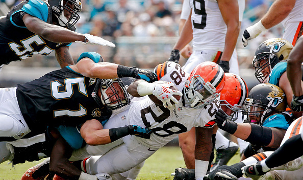 Terrance West #28 of the Cleveland Browns is stopped by Paul Posluszny #51 of the Jacksonville Jaguars during the second quarter of the game at EverBank Field on October 19, 2014 in Jacksonville, Florida.  (Photo by Rob Foldy/Getty Images)