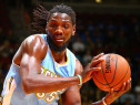 Kenneth Faried of the Denver Nuggets looks to pass against the Golden State Warriors in an NBA Pre-Season game on October 16, 2014 at the Wells Fargo Arena in Des Moines, Iowa.  (credit: Jason Bradwell/NBAE via Getty Images)