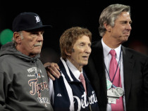 DETROIT, MI - OCTOBER 18:  (L-R) Manager Jim Leyland, team owner Mike Ilitch and General Manager Dave Dombrowski of the Detroit Tigers look on during the American League Championship trophy presentation after the Tigers won 8-1 against the New York Yankees during game four of the American League Championship Series at Comerica Park on October 18, 2012 in Detroit, Michigan.  (Photo by Leon Halip/Getty Images)
