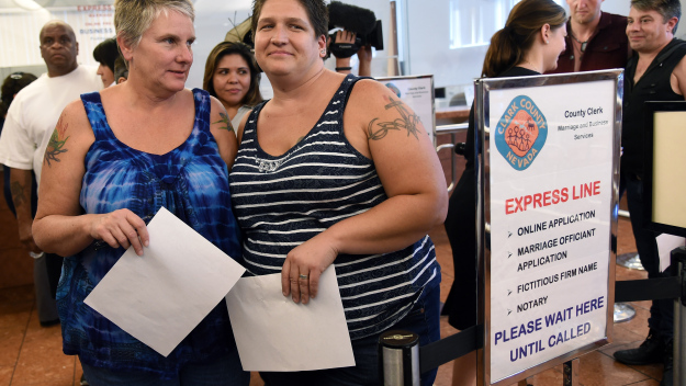 Cathy Grimes (L) and Tara Traynor, both of Nevada, obtain a marriage license   (Photo by Ethan Miller/Getty Images)