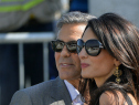 George Clooney ( L) and Amal Alamuddin, his Lebanon-born British fiancee, on a taxiboat in Venice upon their arrival on September 26, 2014. Heart throb actor George Clooney is to marry his British lawyer fiancee Amal Alamuddin in Venice on September 27.   (credit: ANDREAS SOLARO/AFP/Getty Images)
