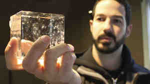Joe Ambrose of Favourite Ice holds one of his crystal-clear artisanal cubes.