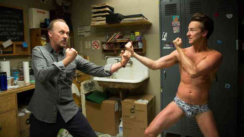 In Birdman, Ed Norton (right) plays a talented but pretentious actor in a Broadway play being directed by an actor he disrespects (Michael Keaton, left) for having starred in a series of Birdman superhero films.