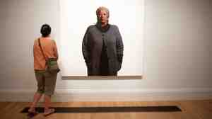 A woman looks at an oil portrait of Toni Morrison at the National Portrait Gallery. A self-portrait of sorts, Morrison's life of fiction drawn in words will be permanently kept at Princeton.
