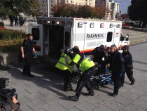 Police and paramedics transport a wounded Canadian soldier on October 22, 2014 in Ottawa, Ontario. (credit: MICHEL COMTE/AFP/Getty Images)