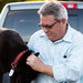 David Clayton and his dog in his Ram 1500, which had an axle defect that wasn’t repaired.