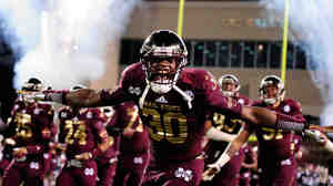 Brandon Wells of the Mississippi State Bulldogs takes the field before a game against the Ole Miss Rebels last year.