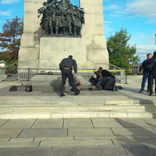 A Canadian soldier who was shot outside the war memorial on Parliament Hill in tended to in Ottawa on Wednesday.