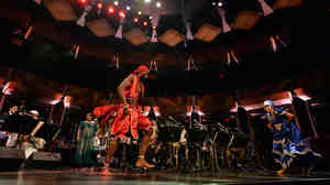 Dreiser Durruthy Bambolé (left) and Yesenia Fernandez Selier dance in front of the Jazz at Lincoln Center Orchestra.
