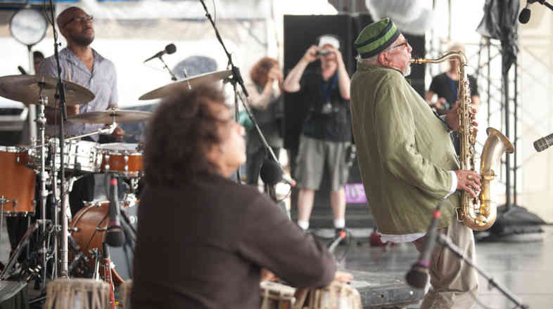 Sangam performs at the 2011 Newport Jazz Festival. From left to right: Eric Harland, Zakir Hussain and Charles Lloyd.