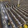 An Amazon.com employee walks down one of the miles of aisles at an Amazon.com Fulfillment Center in Phoenix.