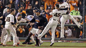 The San Francisco Giants' Travis Ishikawa reacts Thursday after hitting a walk-off three-run home run during the ninth inning of Game 5 of the National League Championship Series against the St. Louis Cardinals.