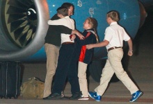 Jeffrey Fowle, who was detained for more than seven months in North Korea, is greeted by his family after arriving at Wright Patterson Air Force Base in Fairborn, Ohio October 22, 2014.   REUTERS/Jim Witmer/Dayton Daily News/MCT 