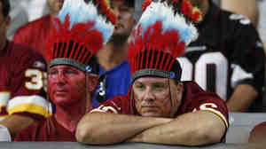 Washington fans watch their team during the second half of an NFL football game against Arizona on Sunday.