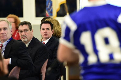 Members of the Sayreville school board listened to comments from the public at Sayreville War Memorial High School on Tuesday night. The board voted to suspend the head football coach and four other coaches from the school.