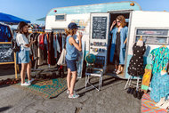 Jaimee Dormer, in doorway, who sells vintage clothes out of a van, swaps her Instagram influence for parking spots.