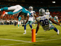 Matt Hazel #83 of the Miami Dolphins is upended with Ahmad Dixon #36 of the Dallas Cowboys on an imcomplete pass in the fourth quarter during a preseason game at Sun Life Stadium on August 23, 2014 in Miami Gardens, Florida.  (Photo by Rob Foldy/Getty Images)