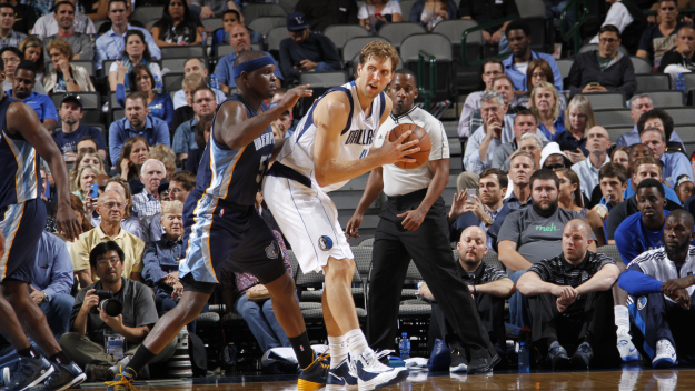 Dirk Nowitzki posts up against Zach Randolph of the Memphis Grizzlies Monday night at the American Airlines Center.  (Photo by Glenn James/NBAE via Getty Images)
