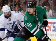 Jason Spezza of the Dallas Stars controls the puck against Radko Gudas of the Tampa Bay Lightning and Ben Bishop of the Tampa Bay Lightning in the third period of a preseason game at American Airlines Center on September 30, 2014 in Dallas, Texas. (credit: Tom Pennington/Getty Images)