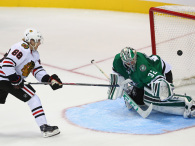 Patrick Kane scores in a shootout against Kari Lehtonen #32 of the Dallas Stars at American Airlines Center on October 9, 2014 in Dallas, Texas.  (Photo by Ronald Martinez/Getty Images)