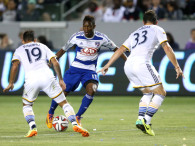 Fabian Castillo #11 of FC Dallas tries to move the ball between Juninho #19 and and Dan Gargan #33 of the Los Angeles Galaxy at StubHub Center on May 21, 2014 in Los Angeles, California. (Photo by StephenDunn/GettyImages)