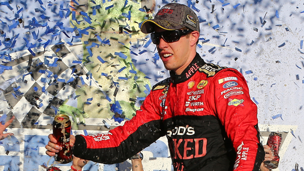 Brad Keselowski, driver of the #2 Redd's Wicked Apple Ale Ford, celebrates in victory lane after winning the NASCAR Sprint Cup Series GEICO 500 at Talladega Superspeedway on October 19, 2014 in Talladega, Alabama. (credit: Jonathan Ferrey/Getty Images)