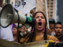 People protest for greater action against climate change during the People's Climate March on September 21, 2014 in New York City. The march, which calls for drastic political and economic changes to slow global warming, has been organized by a coalition of unions, activists, politicians and scientists.  (Photo by Andrew Burton/Getty Images)