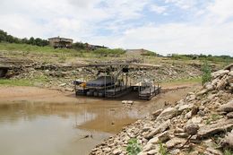 A 2013 look at at a boat dock at Lake Travis, whose water level has decreased markedly amid a historic drought. Lake Travis is part of the Central Texas' Highland Lakes.