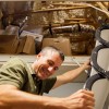 Steve Bijansky climbs down from the attic.