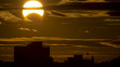 A partial Solar eclipse is seen just after sunrise over the Queens borough of New York across the East River on November 3, 2013 in New York. (STAN HONDA/AFP/Getty Images)