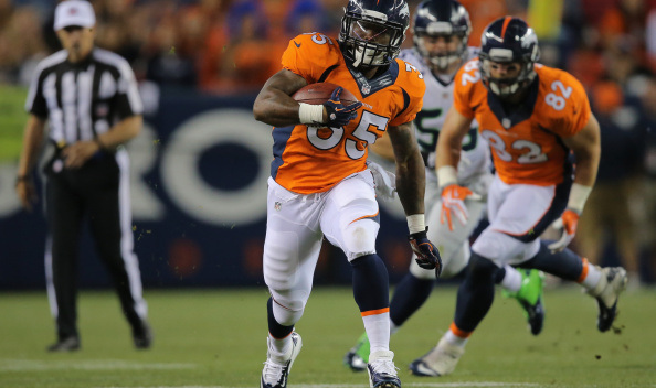 Running back Kapri Bibbs #35 of the Denver Broncos runs with the ball against the Seattle Seahawks during preseason action at Sports Authority Field at Mile High on August 7, 2014 in Denver, Colorado. The Broncos defeated the Seahawks 21-16.  (Photo by Doug Pensinger/Getty Images)