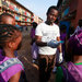 A teacher in Lagos, Nigeria, measured students’ temperatures this month. A fever is one symptom of the Ebola virus.