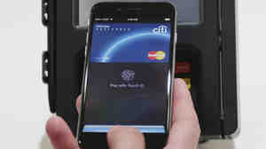 Apple Pay is demonstrated at Apple headquarters in Cupertino, Calif.