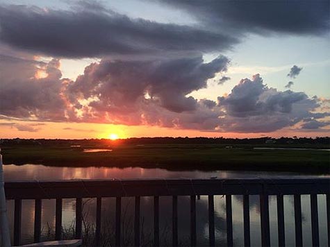 image of sunset over water