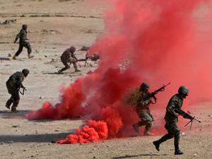 22 October 2014: Afghan National Army (ANA) soldiers participate in a combat training exercise at the Afghan National Military training center (KMTC) in Kabul
