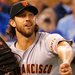 Giants starter Madison Bumgarner threw in time to catch a runner at first. Bumgarner held the Royals to three hits and a run in seven innings.