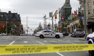 Shootings leave suspect and soldier dead as police sweep Ottawa  – live updates