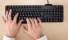 Person using computer keyboard