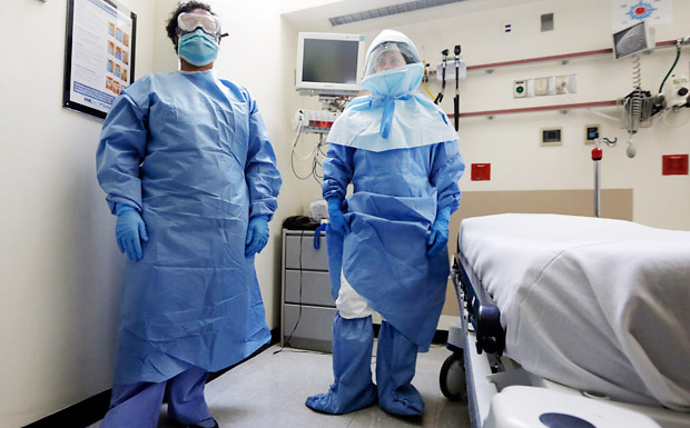 Workers at Bellvue Hospital in New York wear protective gear during a demonstration of Ebola procedures on Oct. 8. Medical records indicate that workers at Texas Health Presbyterian Hospital Dallas treated Ebola patient Thomas Eric Duncan without hazardous materials gear for two days until tests confirmed his diagnosis.