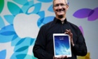 Apple ceo Tim Cook with iPad Air