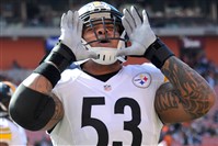  The Steelers' Maurkice Pouncey barks at the Dawg Pound as his team warms up before its game against the Browns at FirstEnergy Stadium in Cleveland.