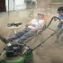 Bill Murray relaxes while Jaeden Lieberher mows his lawn in St. Vincent.